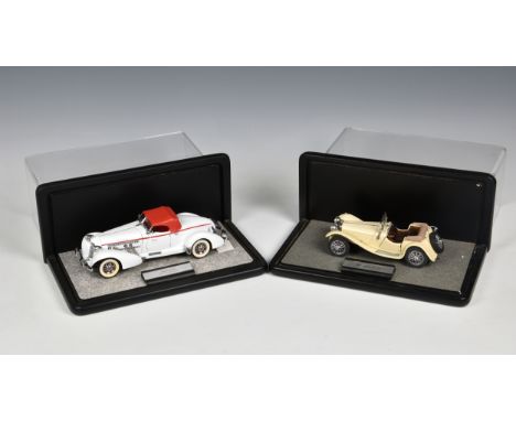 Four Franklin Mint 1:12 scale model cars in display cases, including a Mercedes 500 K Special Roadster; a 1935 Auburn Boattai