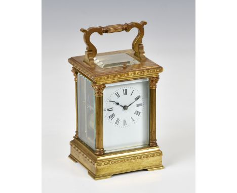 A French gilt brass carriage clock with repeat, c.1900, with Corinthian column case, Roman white enamel dial, twin train move