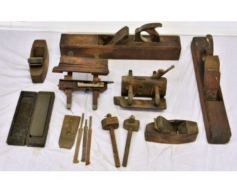 A large collection of various antique woodworking planes of varying forms, to include jack, plough/trench, coffin, grooving e