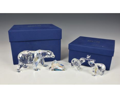 A Swarovski Crystal Siku Polar Bearwith ice boulder inscribed and dated 2011, with box and certificate, 3 1/8in. (8cm.) high,