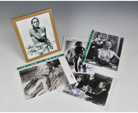 A small collection of James Bond 007 related signed photographs to include Roger Moore &amp; Julian Glover, signed in blue ma