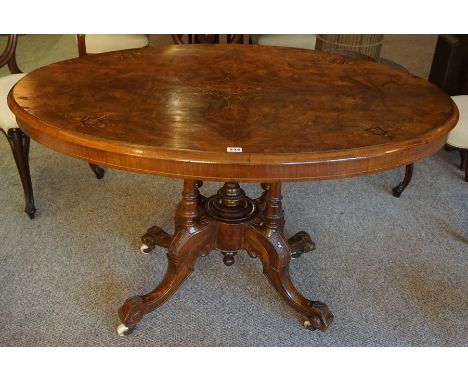 A Victorian Figured Walnut Inlaid Loo Table, The oval snap action top decorated with satinwood inlaid panels, raised on four 