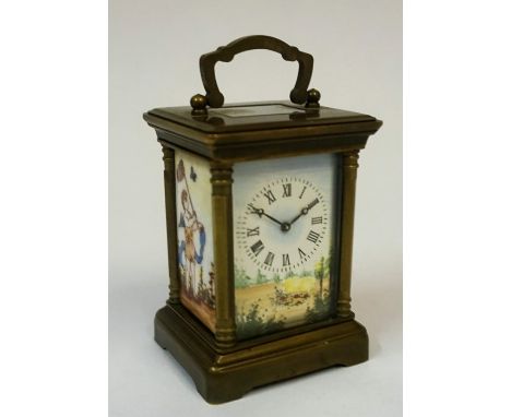 A Small Gilt Metal Cased Carriage Clock, With enamel dial and side panels, 10cm high, with key
