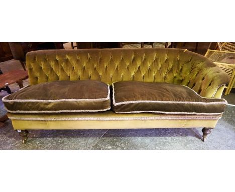 A 19th Century Two Seater Buttonback Sofa, Upholstered in later green velour, raised on brass castors, 73cm high, 200cm wideC