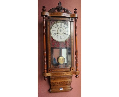 A Victorian Walnut Marquetry Wall Clock, With a twin train dial, 103cm high