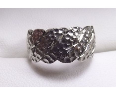 A 9ct white gold textured wedding band, 4.8g, size K