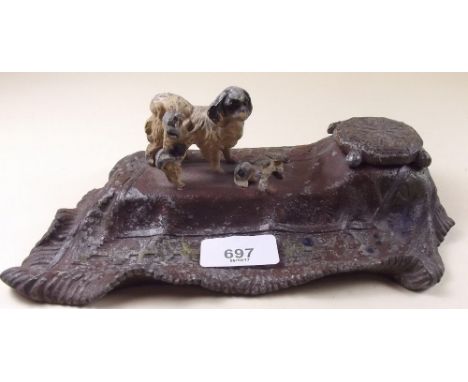 A Victorian spelter inkwell with pug dogs and puppies