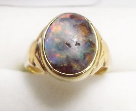 An Australian boulder opal ring set in gold (not hallmarked) , size J