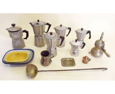 A group of kitchenalia to include a set of graduated coffee pots, enamel dishes etc