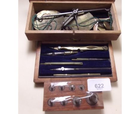 A set of gold weights and scales - boxed, a set of extra weights in box and a compass set