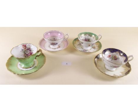 A set of four various floral Hammersley cabinet cups and saucers
