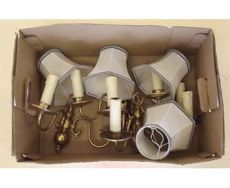 A small brass four branch light fitting and four matching wall lights