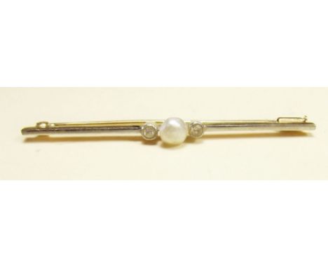 A 14 carat gold bar brooch set pearl flanked by white sapphires