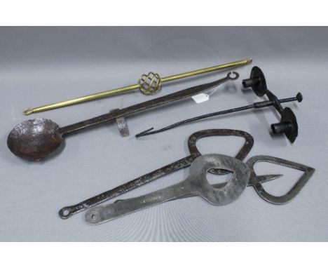 Collection of hand forged items to include an iron ladle 62cm long, double candlestick, etc and a brass rod with spiral patte
