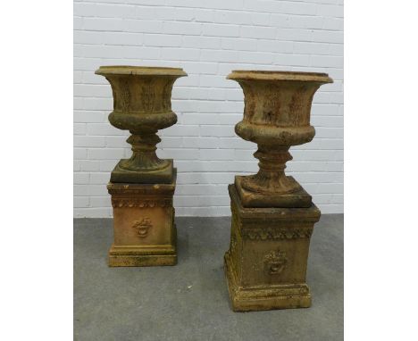 Pair of fireclay garden urns, campana form with acanthus leaf detail, on rectangular plinths . 93 x 43cm. (2) 