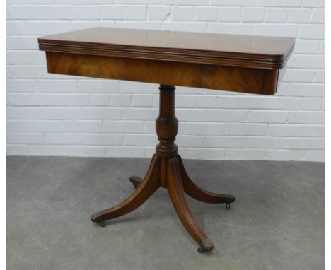 Reproduction fold over card table on outswept  reeded legs with brass caps and castors, 75 x 85cm 