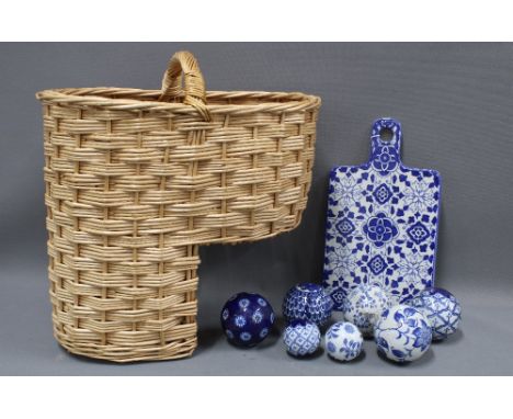 Collection of modern blue and white carpet bowls, a blue and white ceramic cheese board and a stair basket (a lot) 