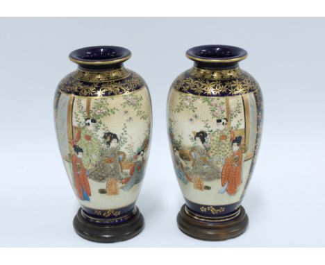 Pair of Japanese satsuma vases, gilded and painted with a female in a garden, signature mark to base (2) 17cm. 