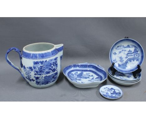 Chinese blue and white cider jug, lid lacking, 18cm tall together with a group of modern blue and white dishes and saucers, (
