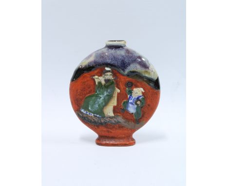 Japanese Sumida Gawa type vase of flask form  decorated with two figures, one playing a flute the other with symbols 13cm. 