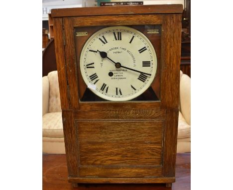 An early 20th century, factory, table-top, eight-day clock in an oak case: The Gledhill-Brook Time Recorders Ltd with a conne