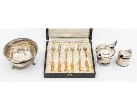 A collection of silver to include: a set of six George V silver and enamel cocktail forks, hallmarked/imported by George Stoc