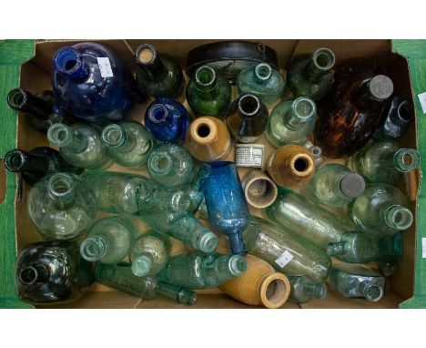 A mixed collection of late 19th century and early 20th century glass bottles, stoneware bottles, a Prattware lid of the 1878 