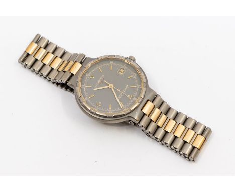 Longines- a Gentleman's titanium and gold plated "Conquest" quartz wristwatch, comprising a signed round grey with applied go