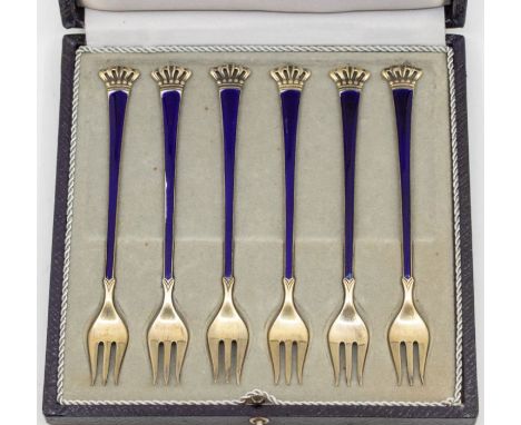 A set of six Danish silver gilt and cobalt blue enamel pastry / cocktail forks, with coronet terminals, by Elgon Lauridsen, e