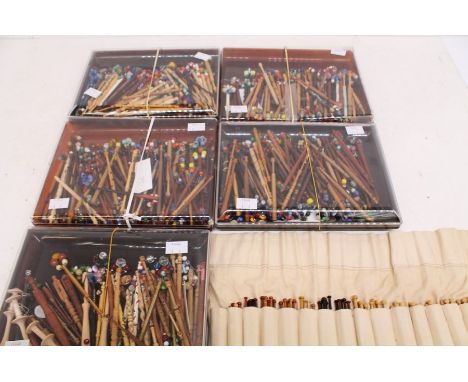 A collection of Bobbin sticks made of various materials, approx. 320 in five clear boxes and approx. 75 in a cloth carry case