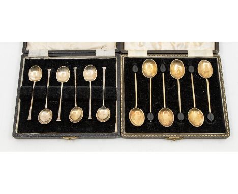 A cased set of six enamel backed coffee bean spoons with gilt bowls and stems, hallmarked for Birmingham 1948 by Henry Cliffo