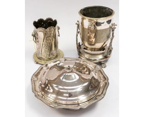 A collection of silver plated items, to include: a large serving dish with lid and glass liner; wine bottle holder on stand (