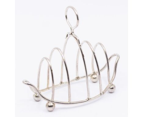 An early 20th century silver five bar toast rack, on ball feet, hallmarked Birmingham, 1897, length approx 12cm, height appro