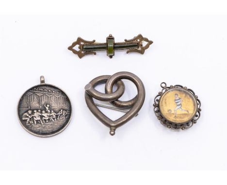 A late 19th Century pendant compass decorated with a enamel footballer, a 1923 silver Tug Of War medal and two silver brooche