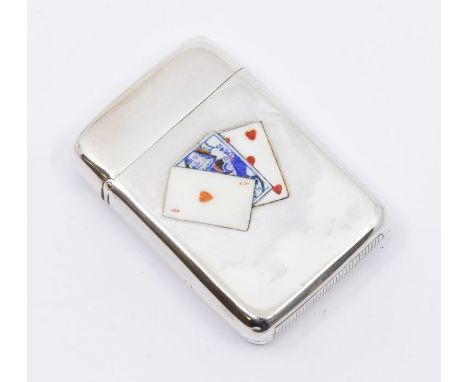 A Victorian silver and enamel vesta case, decorated with enamel playing cards, the reverse with engraved monogram, size appro