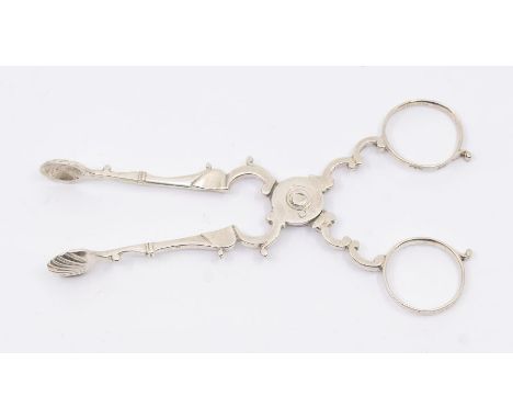 A pair of George III silver scissor sugar nips, marks indistinct to circular handle but can see part to the Lion Passant mark