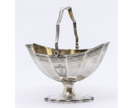 A Georgian silver sugar basket with bright cut engraved decoration to sides including shield motifs, gilt interior and hallma