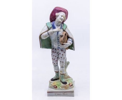 A Staffordshire figure of 'Flemith Mufic' - a Flemish Musician, titled, standing on a square base, circa 1790. Size: approx. 