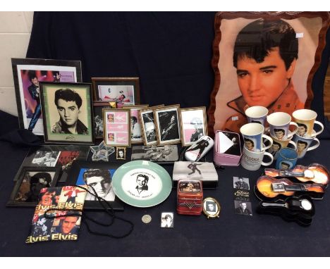 A collection of Elvis memorabilia, including a large wall clock