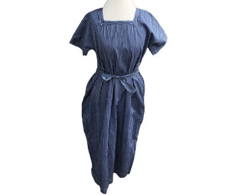 A late Edwardian or early 1920s work overall (could have been used in a laundry,&nbsp;or a factory) in blue striped cotton. A