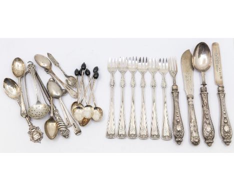A collection to include; a set of six Gorham white metal pickle forks with shell and feather detailed stems, three pronged, a