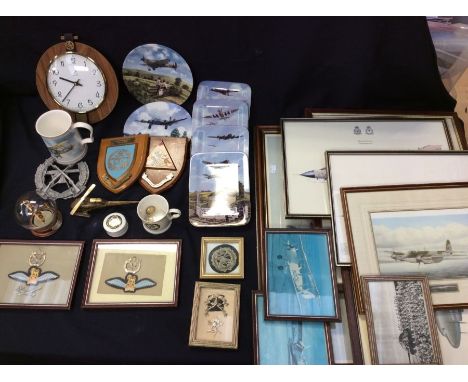 A collection of militaria items including prints, mugs, plate, badges, models, clock, plaques, brass wares,&nbsp; etc