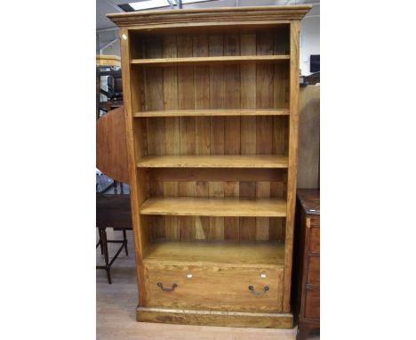 A reproduction light oak five-shelf bookcase with a single drawer to the base.