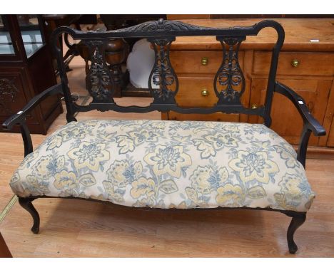 An ebonised Edwardian two-seater parlour sofa chair, along with an ebonised early 20th Century single chair