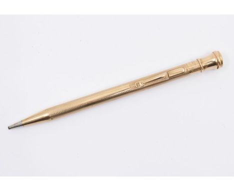 A vintage Eversharp 9ct gold engine turned seal top pencil holder, hallmarked by W.E.C., date letter U., overall weight 19.3 