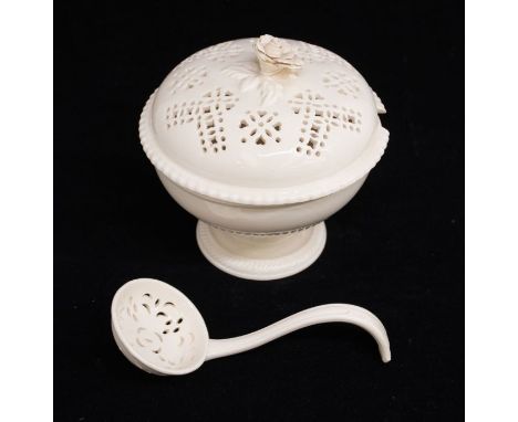 A late 18th Century Creamware tureen, cover and ladle, the plain circular bowl with gadroon lower section and foot rim, retic