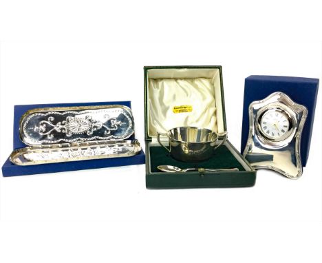 CONTEMPORARY SILVER FRAMED BEDSIDE TIMEPIECE, by R. Carr, the white enamel dial with Roman numerals, the frame with threaded 