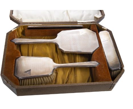 SILVER BACKED FOUR PIECE DRESSING TABLE SET, maker Samuel M. Levi, Birmingham marks, comprising a hand mirror, hairbrush, com