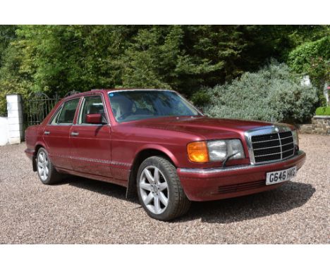 A 1990 Mercedes-Benz 420 SE saloon, registration number G646 HKG, Almandine metallic red. This 420SE (126 Series) saloon was 