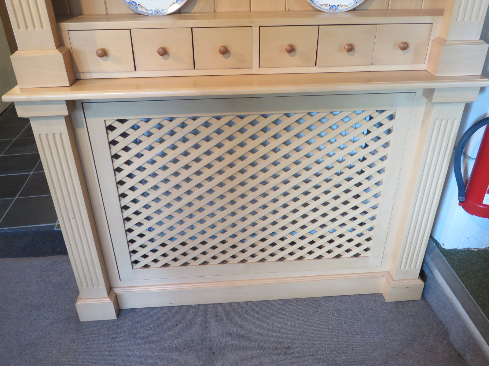A Beech Radiator Cover Unit With Shelves And Spice Drawers Above